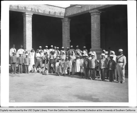 1910A_group_of_about_fortyfour_women_and_children_Yaqui_Indian_prisoners_under_guard_Mexico_ca1910 copy